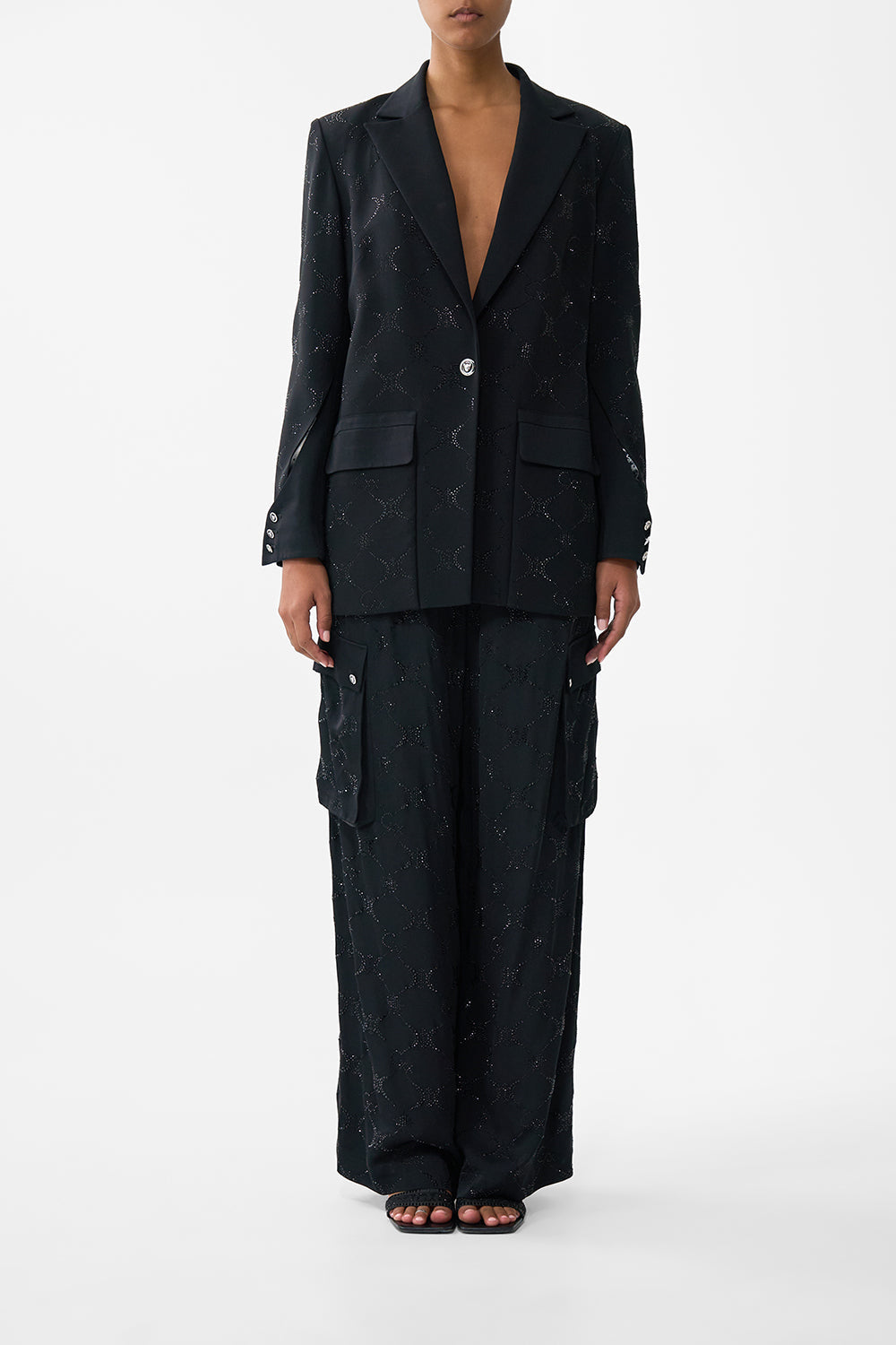 The CAMILLA JACKET WITH SLEEVE CUT OUT DETAIL SOLID BLACK in our SOLID BLACK print.