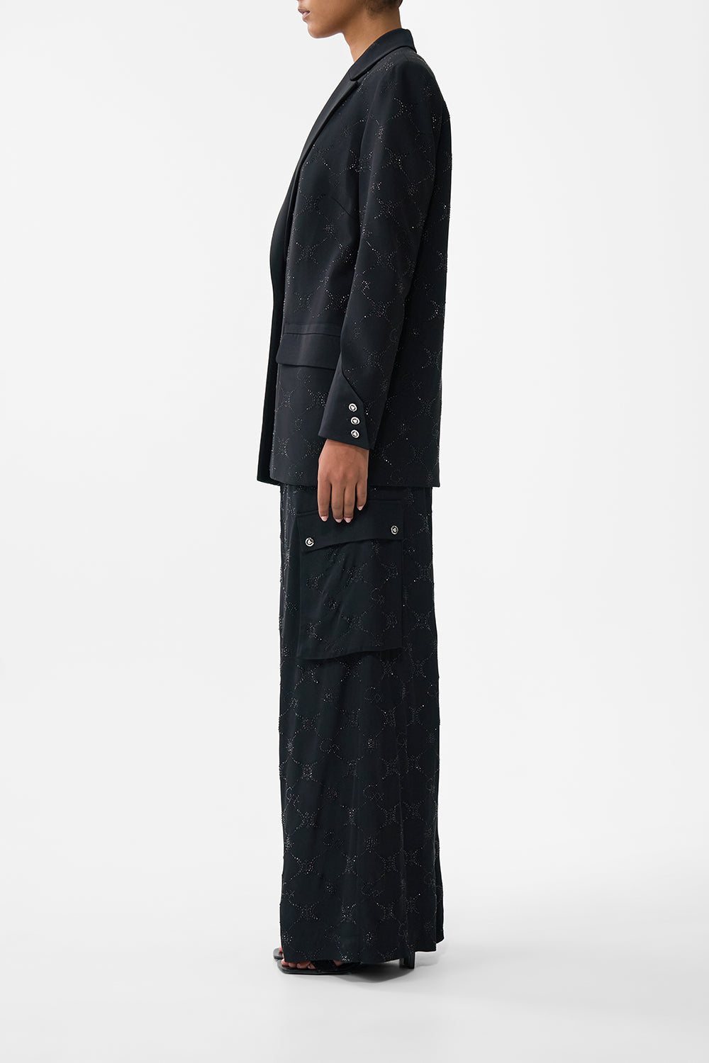 The CAMILLA JACKET WITH SLEEVE CUT OUT DETAIL SOLID BLACK in our  print.