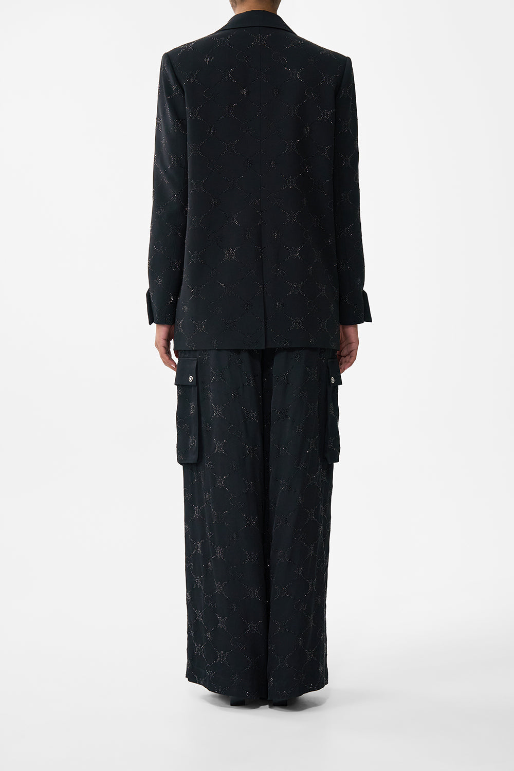 The CAMILLA JACKET WITH SLEEVE CUT OUT DETAIL SOLID BLACK in our  print.