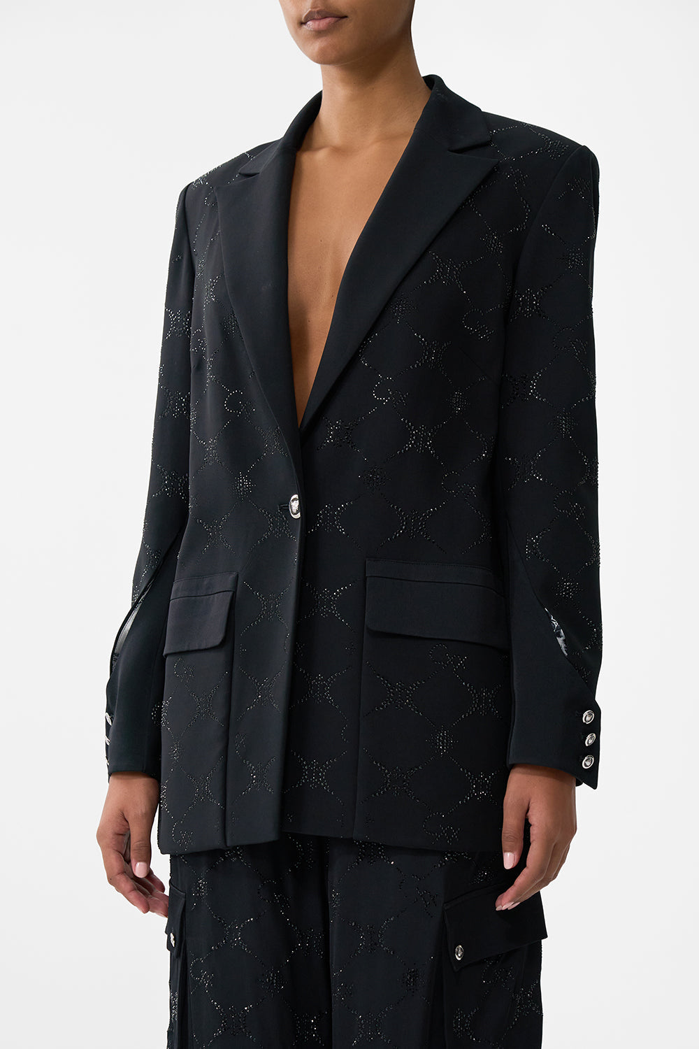 The CAMILLA JACKET WITH SLEEVE CUT OUT DETAIL SOLID BLACK in our  print.
