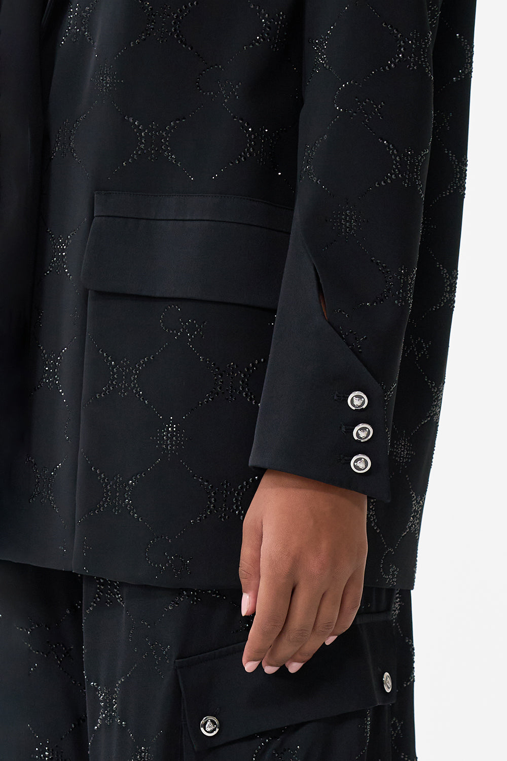 The CAMILLA JACKET WITH SLEEVE CUT OUT DETAIL SOLID BLACK in our  print.