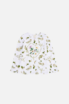 The CAMILLA Kids Long Sleeve Tee With Frill Cuff 4-10 in our Daisy Chains print.