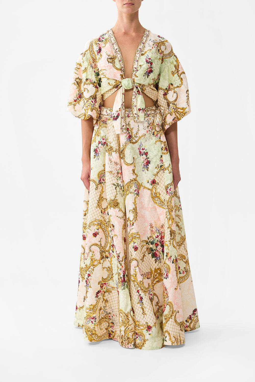 The CAMILLA TIE FRONT PUFF SLEEVE TOP THE QUEENS QUARTERS in our THE QUEENS QUARTERS print.