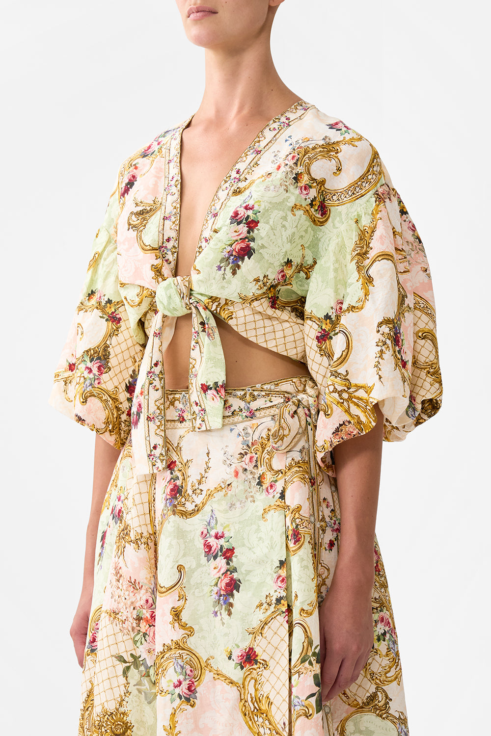 The CAMILLA TIE FRONT PUFF SLEEVE TOP THE QUEENS QUARTERS in our  print.