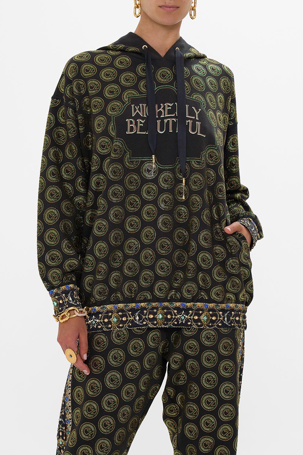 The CAMILLA SILK BAND OVERSIZED HOODIE WITH POCKETS DEFY GRAVITY in our  print.