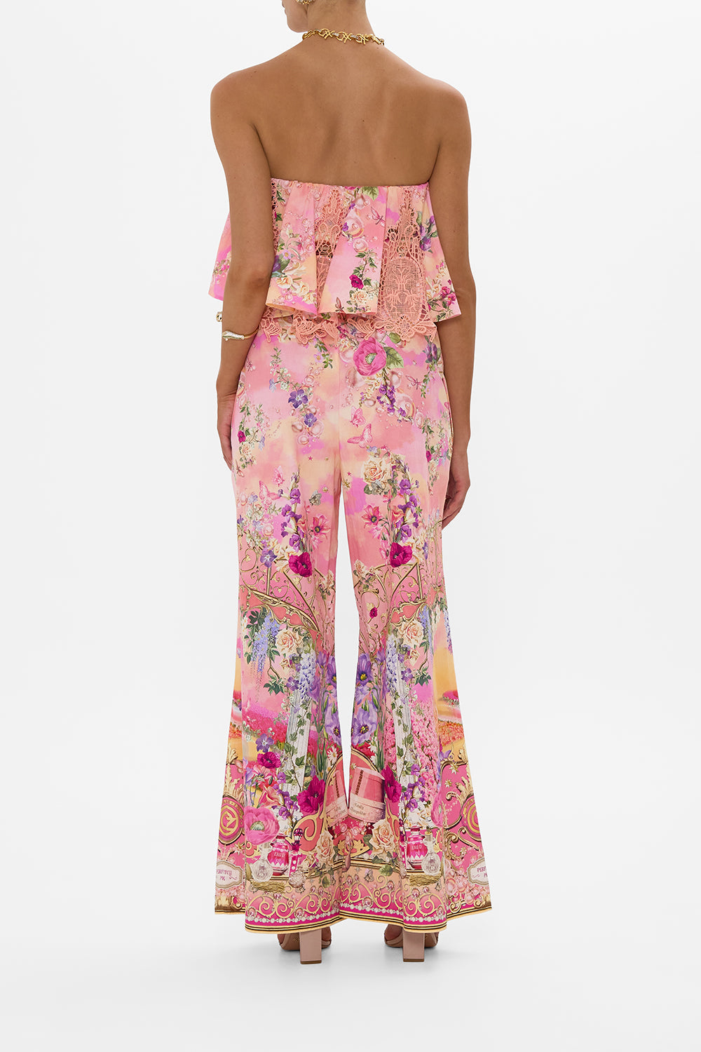 The CAMILLA STRAPLESS JUMPSUIT WITH FRILL TOTALLY OZMOPOLITAN in our  print.