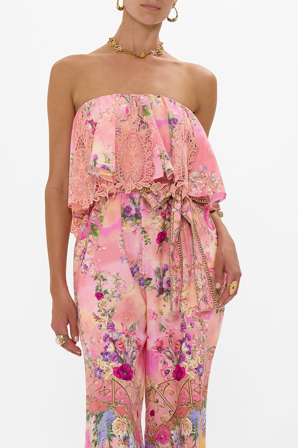 The CAMILLA STRAPLESS JUMPSUIT WITH FRILL TOTALLY OZMOPOLITAN in our  print.