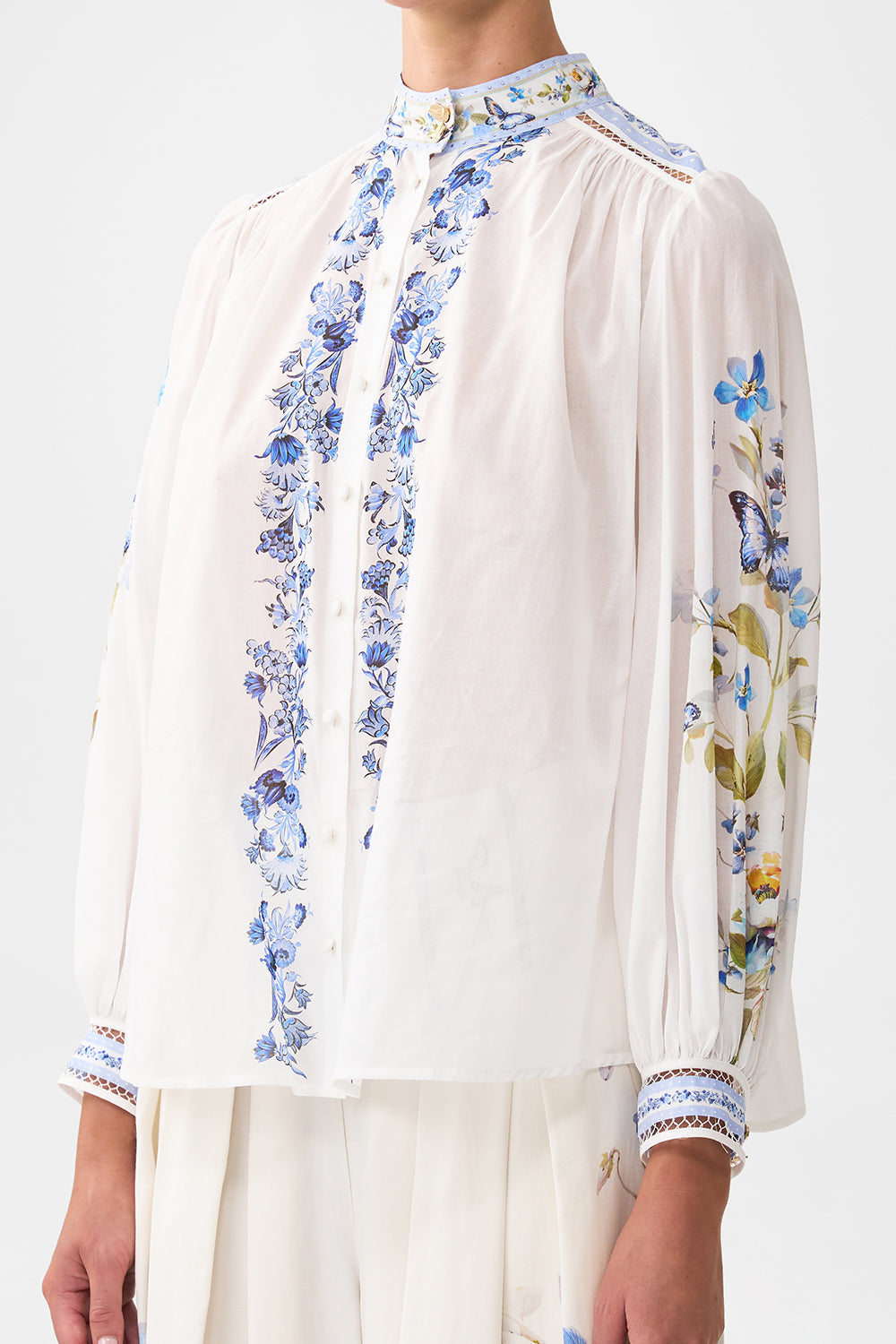 The CAMILLA HIGH NECK BUTTON THROUGH BLOUSE BOTANICAL BALLADS in our  print.