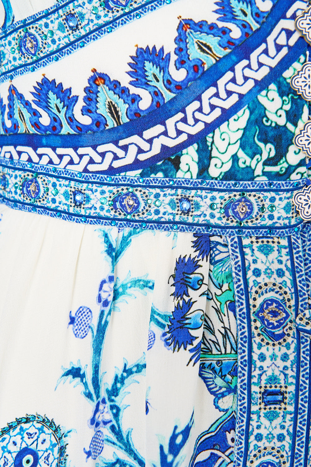 The CAMILLA shaped waistband dress with ruffle sleeve from our print Isnik lullaby