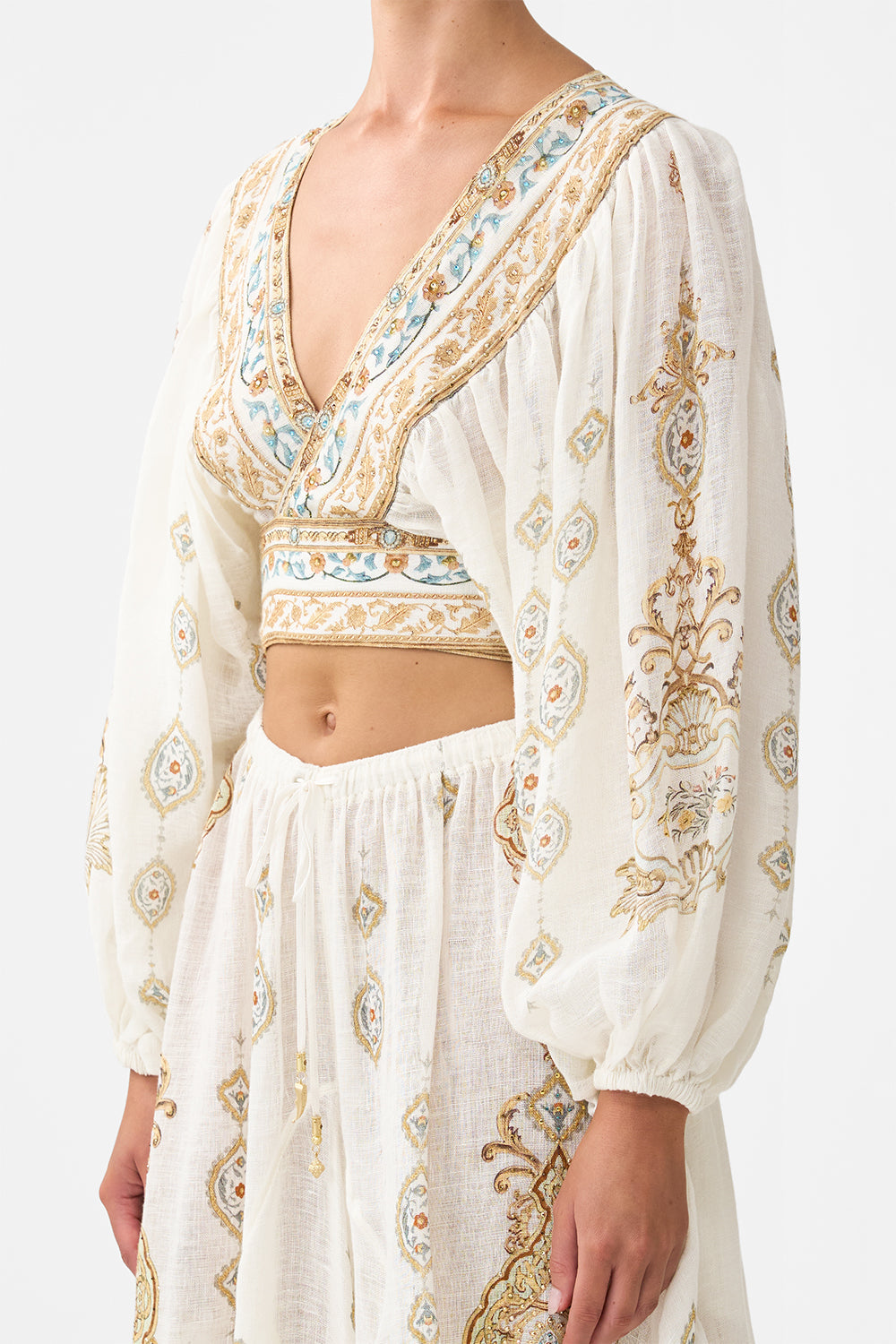 The CAMILLA CROPPED BLOUSON SLEEVE TIE FRONT TOP OTTOMAN DYNASTY in our  print.
