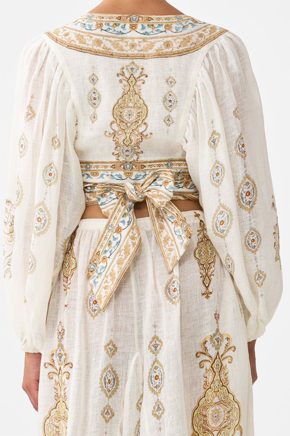 The CAMILLA CROPPED BLOUSON SLEEVE TIE FRONT TOP OTTOMAN DYNASTY in our  print.