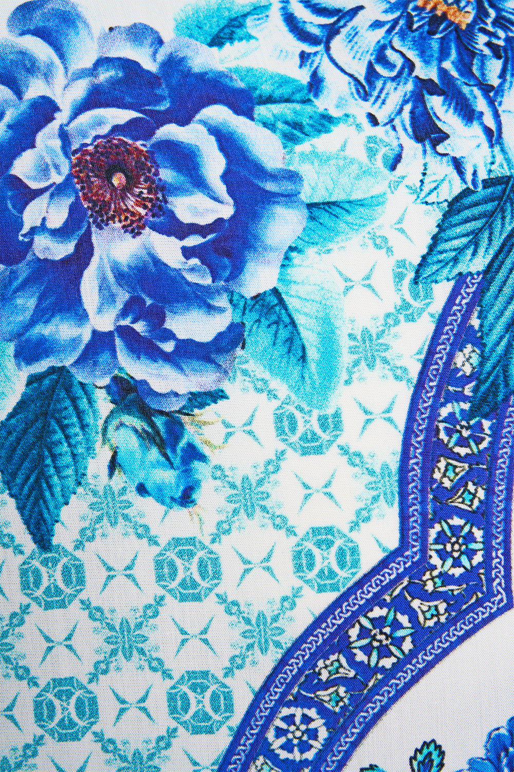 The CAMILLA SHORT SLEEVE CAMP COLLARED SHIRT A CERAMIC GARDEN in our  print.