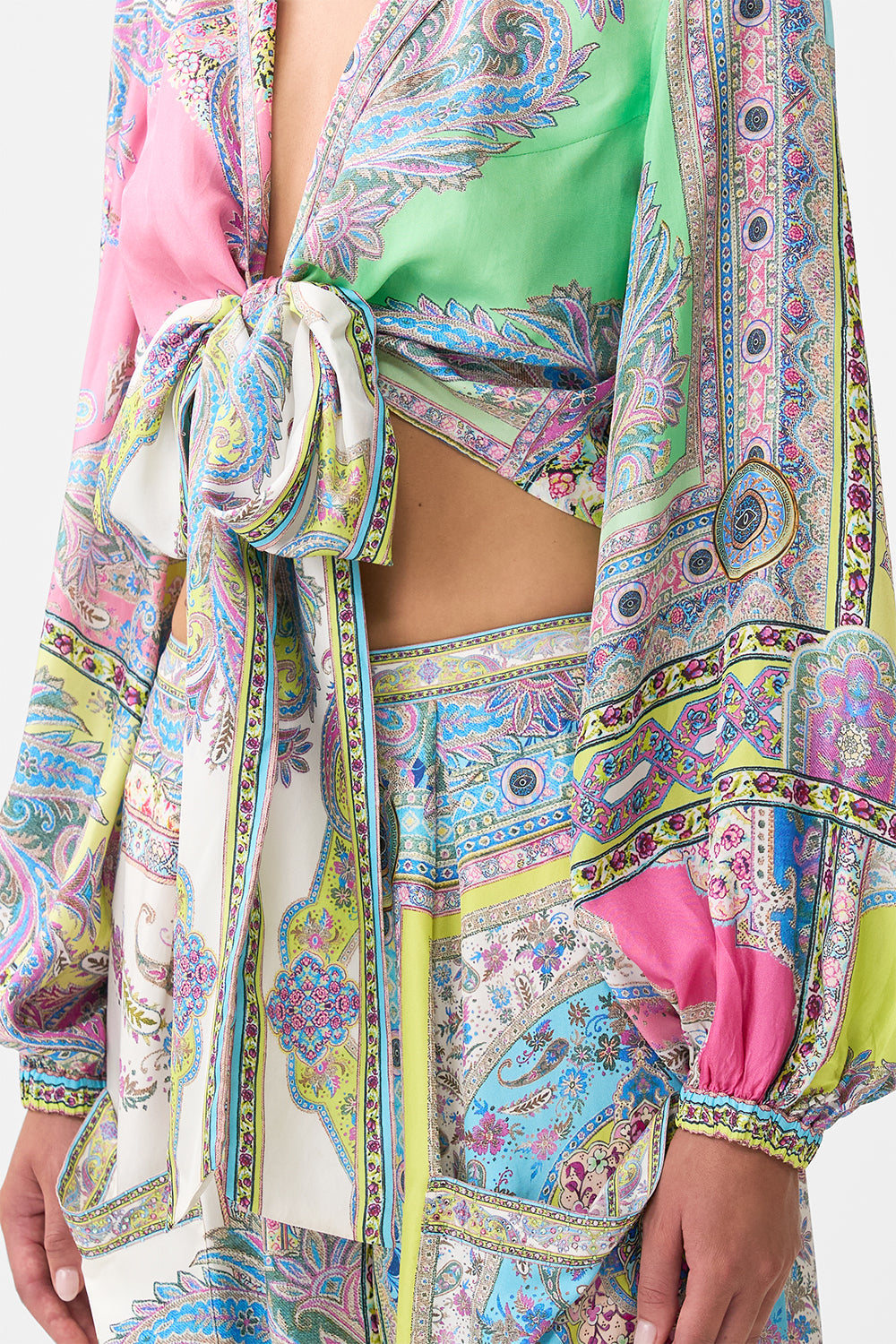 The CAMILLA CROPPED WRAP SHIRT MAGIC CARPET RIDE in our  print.