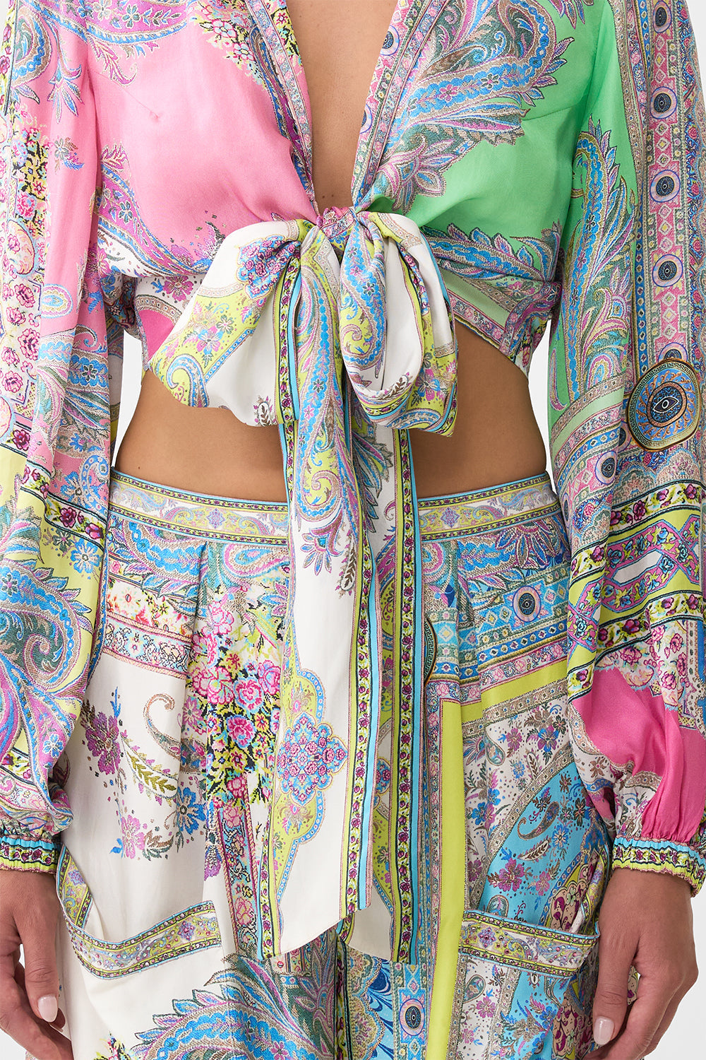 The CAMILLA CROPPED WRAP SHIRT MAGIC CARPET RIDE in our  print.