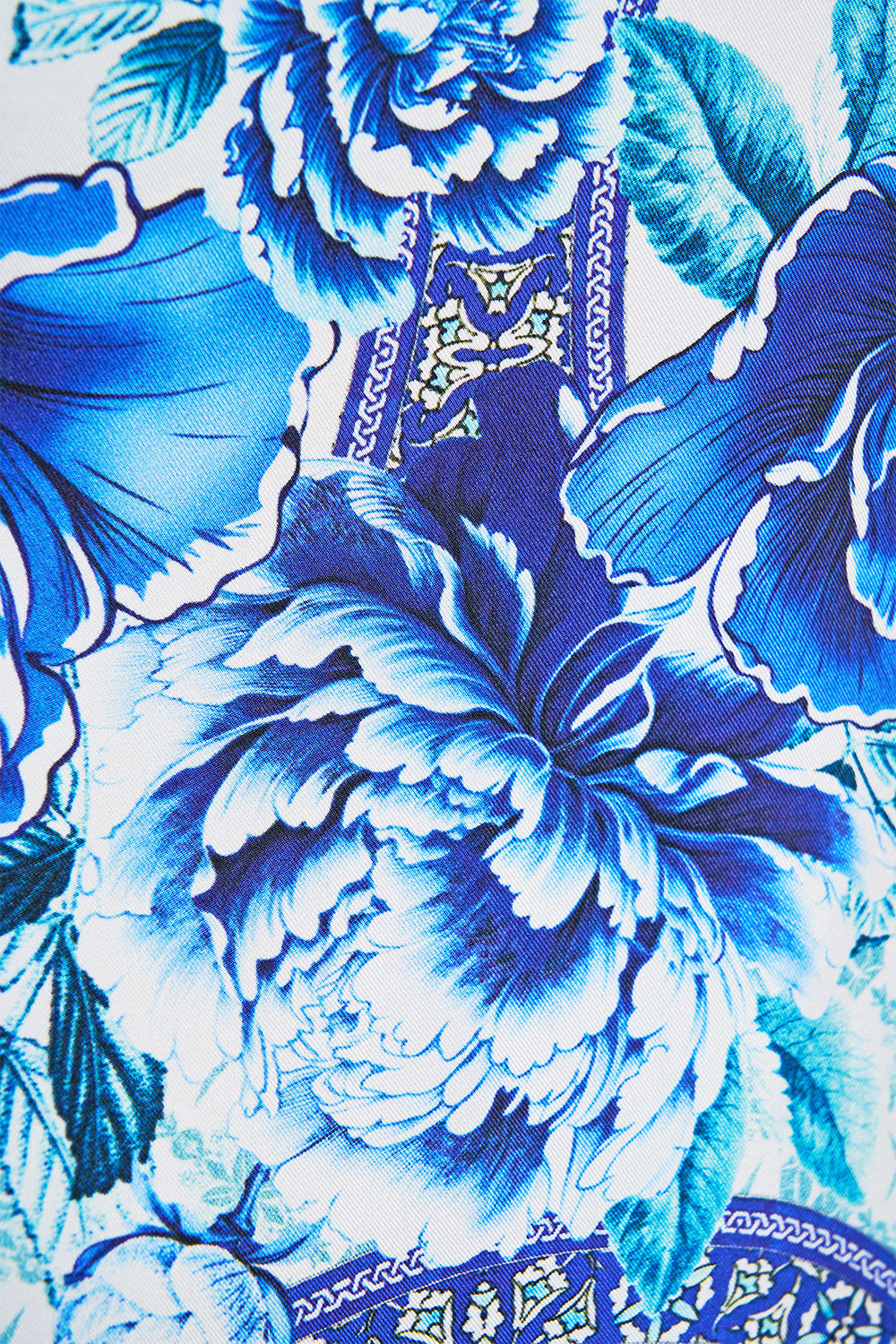 The CAMILLA LONG SLEEVE HIDDEN PLACKET SHIRT A CERAMIC GARDEN in our  print.