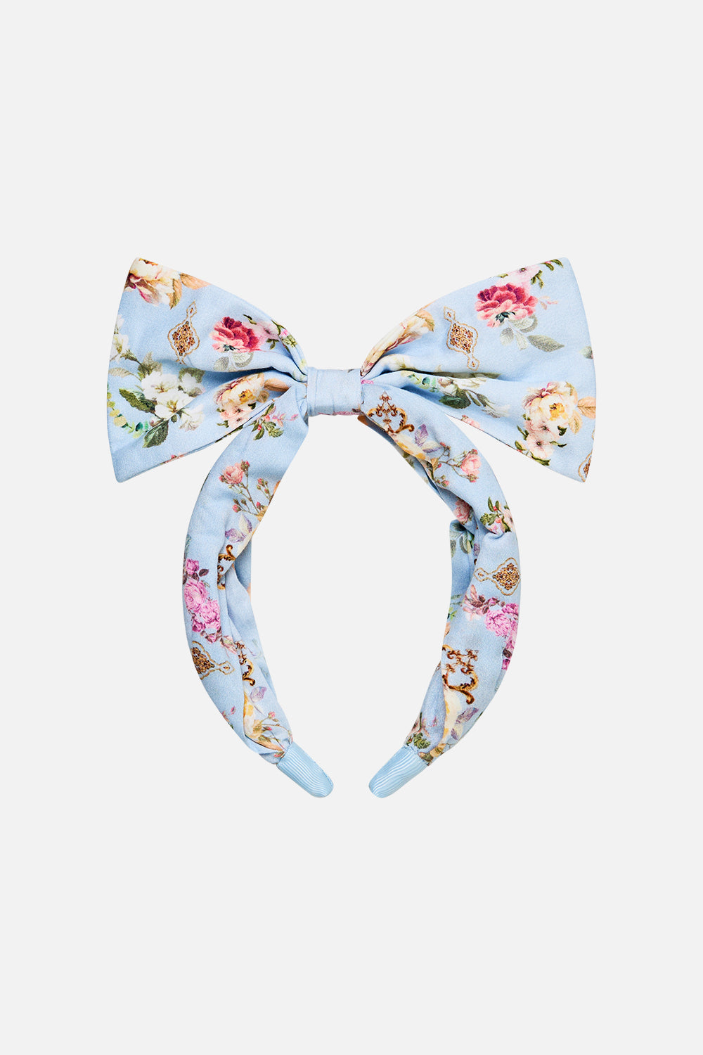 The CAMILLA KIDS HEADBAND WITH LARGE BOW TILED IN TIME in our  print.