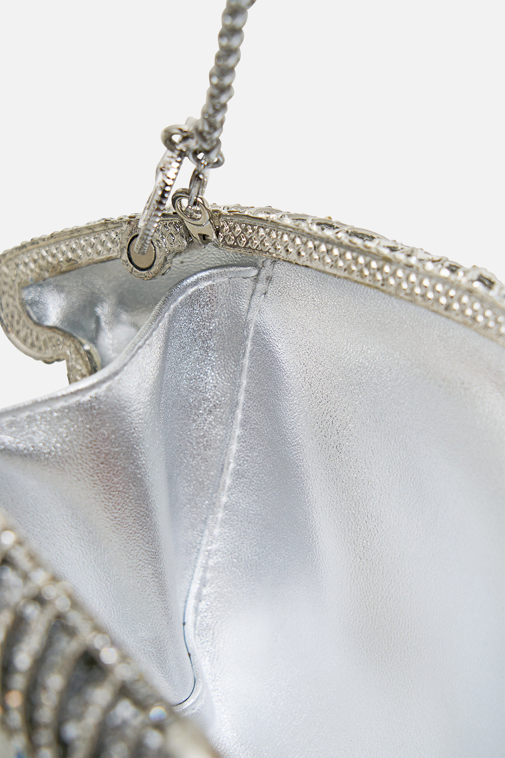 The CAMILLA embellished crystal eye clutch bag in Crystal