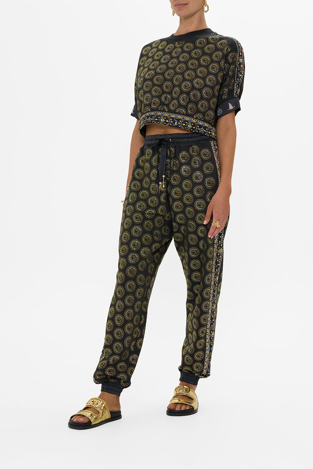 The CAMILLA JERSEY TRACK PANT WITH SIDE PANELS DEFY GRAVITY in our  print.