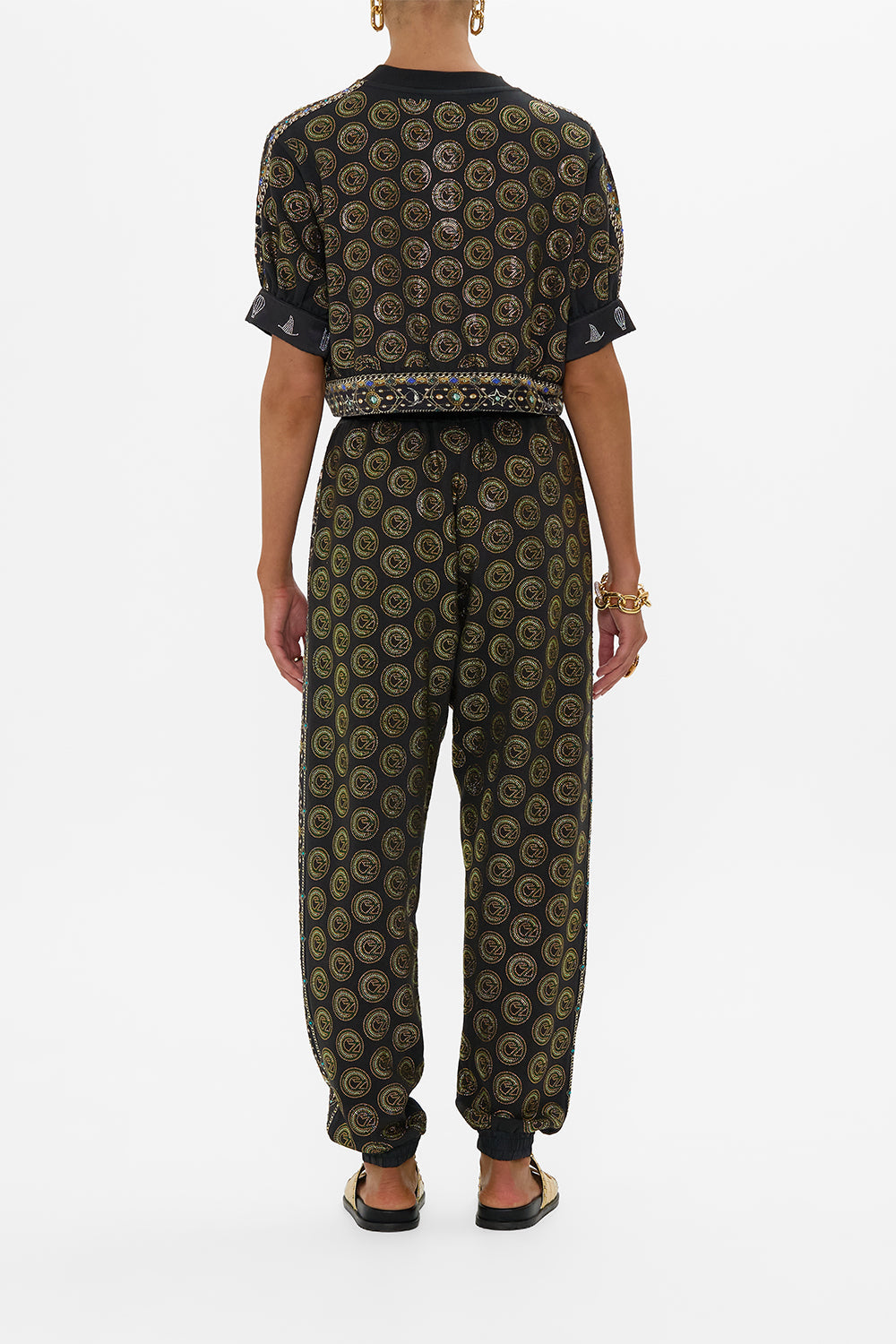 The CAMILLA JERSEY TRACK PANT WITH SIDE PANELS DEFY GRAVITY in our  print.