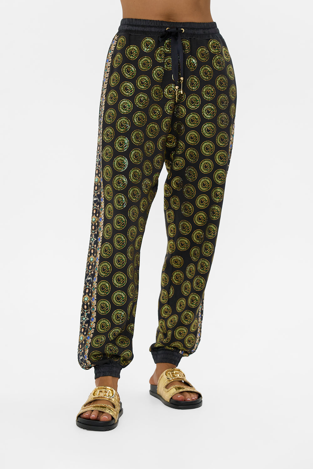 The CAMILLA JERSEY TRACK PANT WITH SIDE PANELS DEFY GRAVITY in our  print.