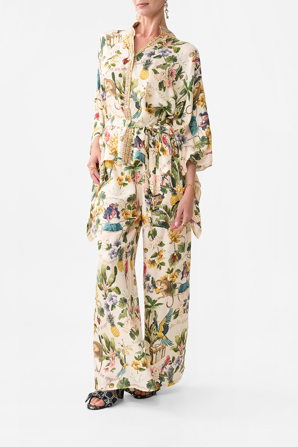The CAMILLA BUTTON THROUGH SCARF BLOUSE WELCOME TO THE WHITE LOTUS in our  print.