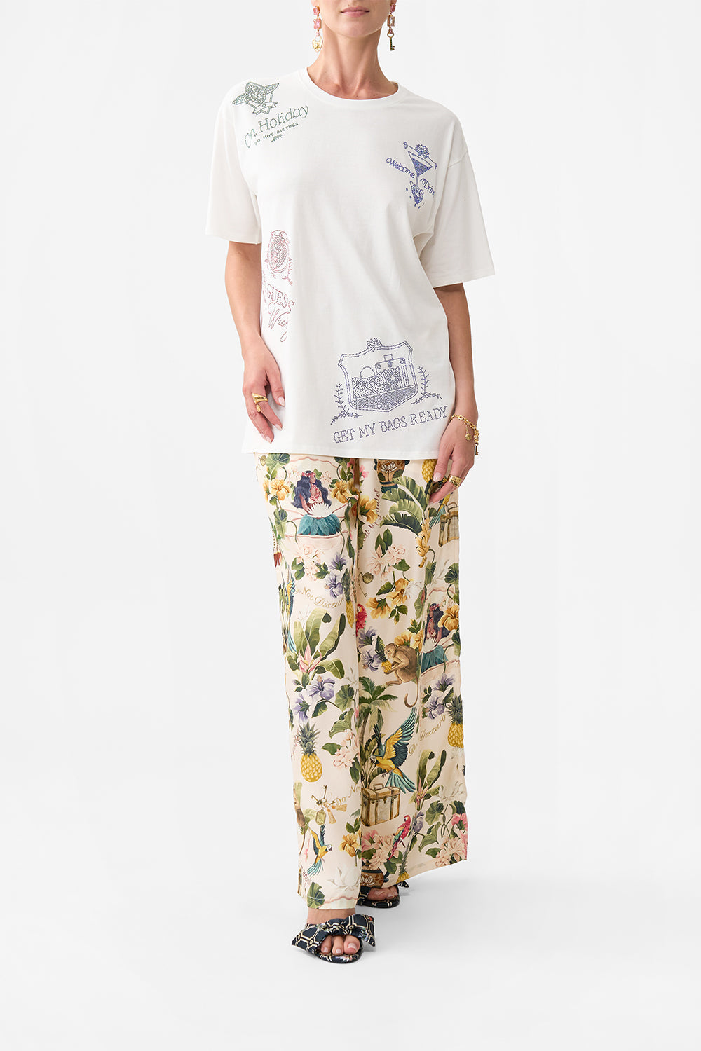 The CAMILLA OVERSIZED BAND TEE WELCOME TO THE WHITE LOTUS in our WELCOME TO THE WHITE LOTUS print.