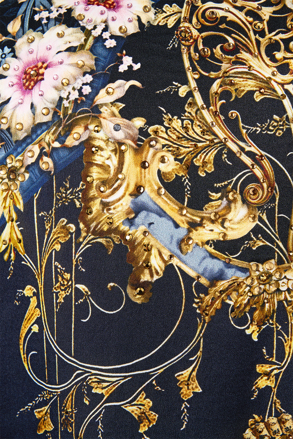 The CAMILLA SILK BACK TURTLE NECK KNIT ORNATE ON A PLATE in our  print.
