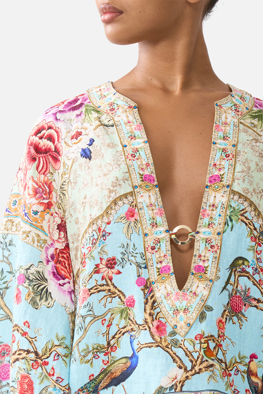 The CAMILLA DEEP V-NECK HARDWARE SHORT KAFTAN SULTANS AND QUEENS in our  print.