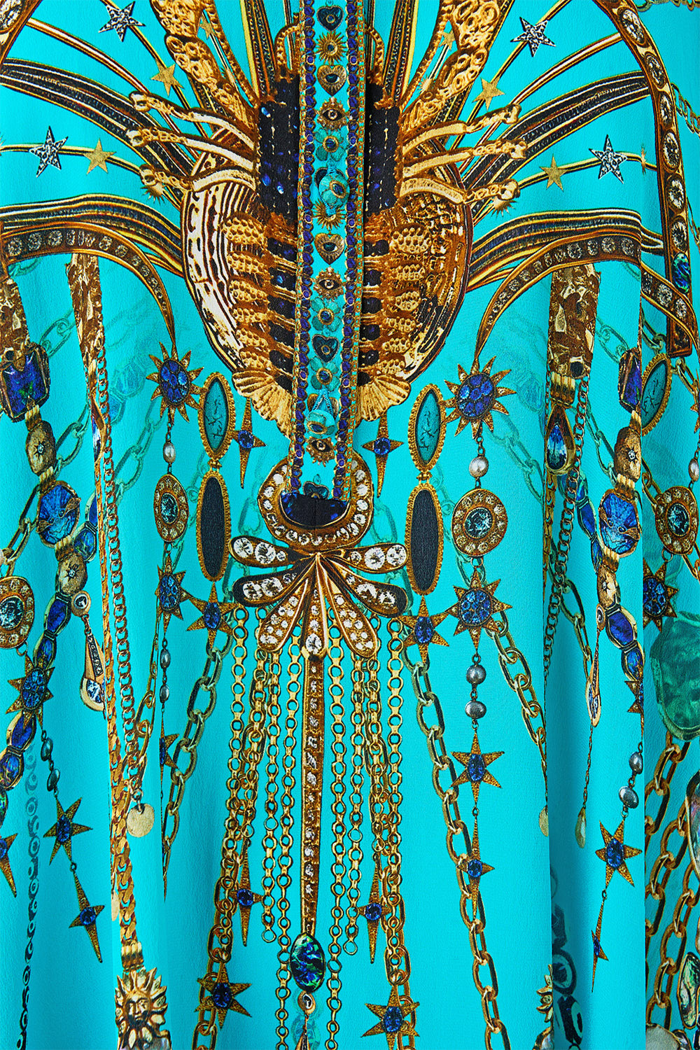 The CAMILLA BUTTON UP TOP WITH DRAPED BACK TOTEMS AND TREASURES in our  print.