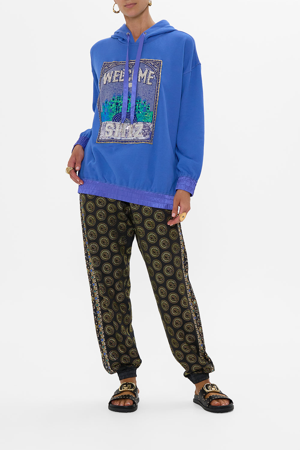 The CAMILLA SILK BAND OVERSIZED HOODIE WITH POCKETS- BLUE DEFY GRAVITY in our DEFY GRAVITY print.