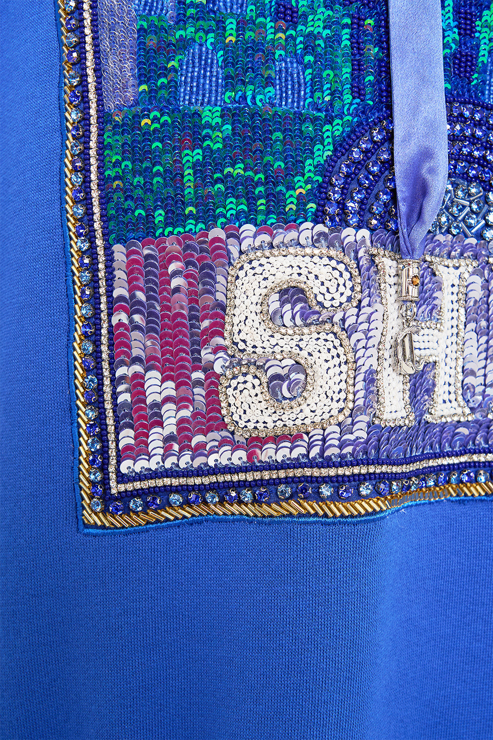 The CAMILLA SILK BAND OVERSIZED HOODIE WITH POCKETS- BLUE DEFY GRAVITY in our  print.