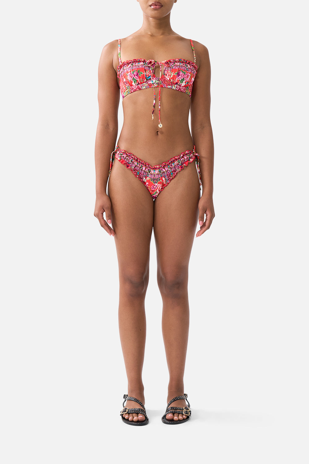 The CAMILLA RUCHED SKIMPY BIKINI BOTTOM WITH TIE SIDES HEIRLOOM EMPIRE in our HEIRLOOM EMPIRE print.