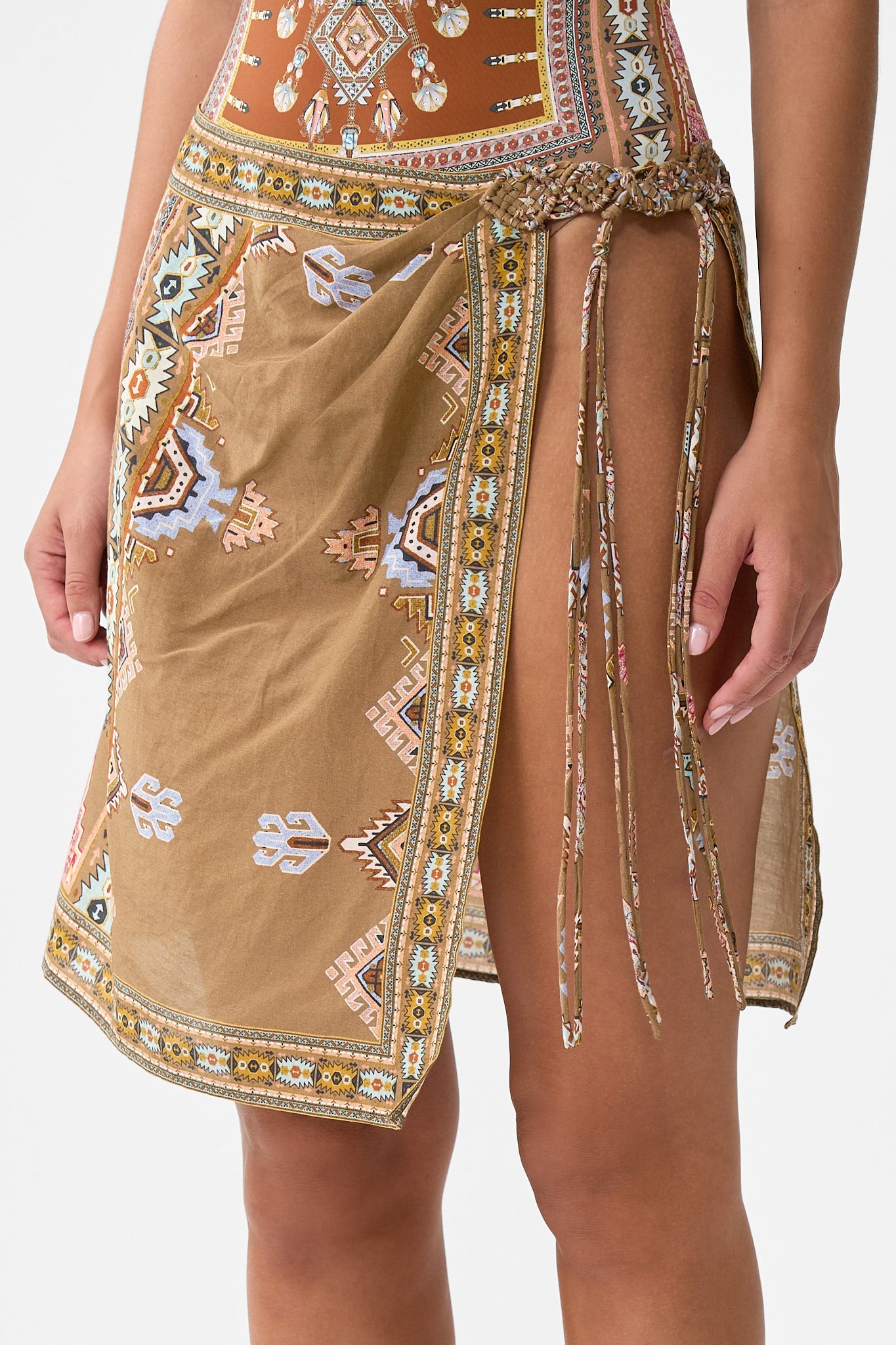 The CAMILLA WOVEN SHORT SARONG WITH MACRAME TIE WAIST FABRIC OF TIME in our  print.