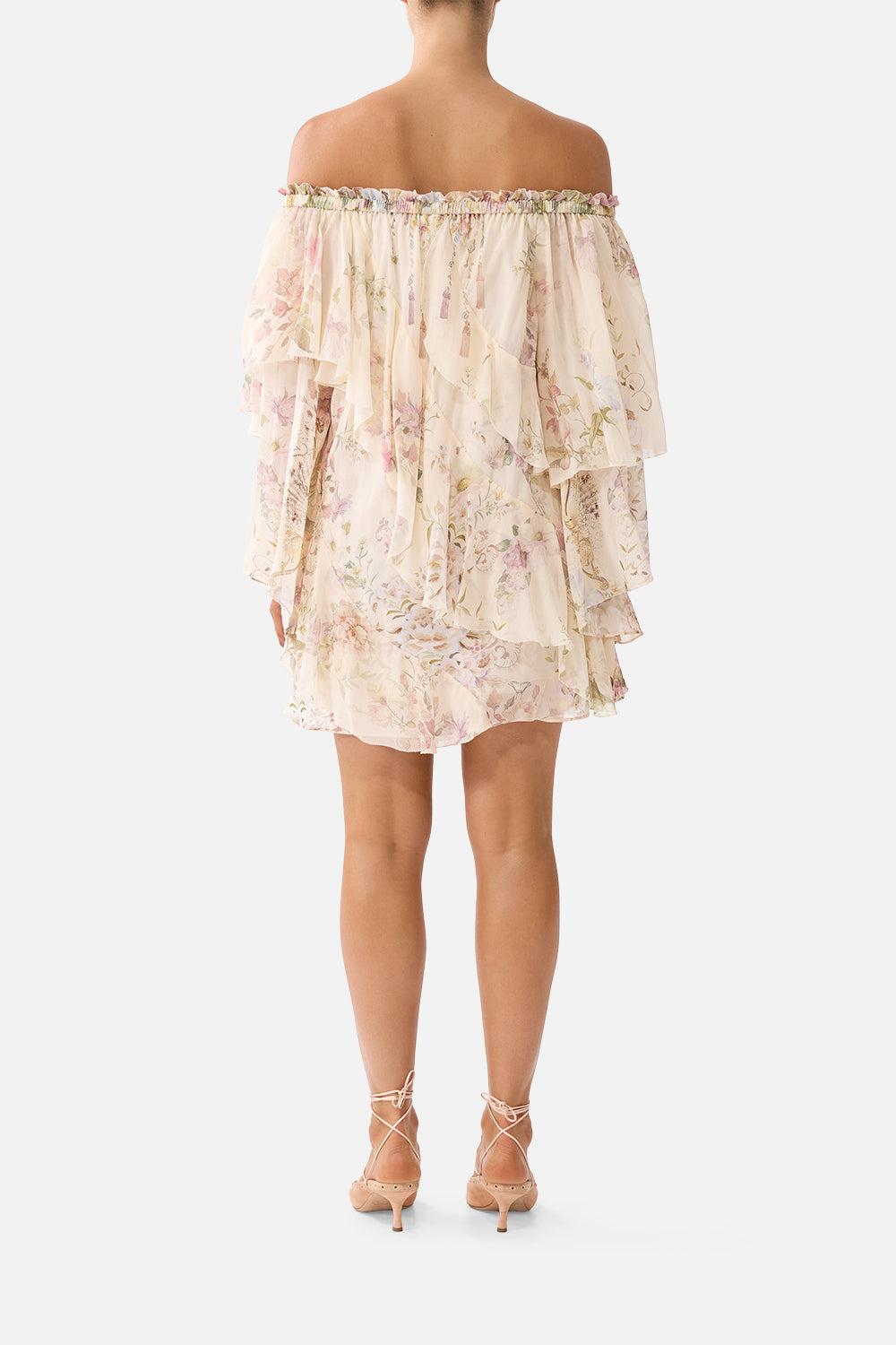 The CAMILLA OFF SHOULDER ASSYMETRIC RUFFLE DRESS ADORNED IN ARANJUEZ in our  print.