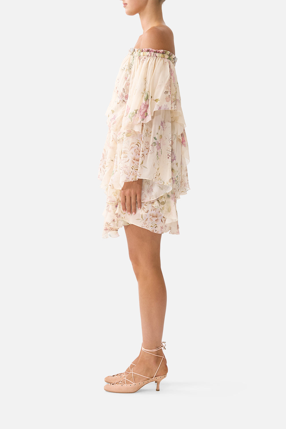 The CAMILLA OFF SHOULDER ASSYMETRIC RUFFLE DRESS ADORNED IN ARANJUEZ in our  print.