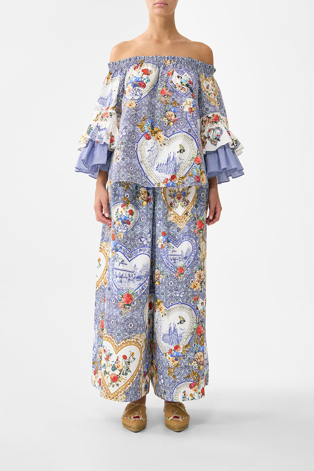 The CAMILLA OFF SHOULDER TOP WITH FRILL SLEEVE THE POTTERY PARLOUR in our THE POTTERY PARLOUR print.