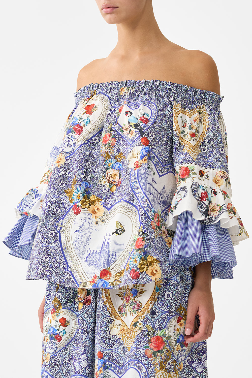 The CAMILLA OFF SHOULDER TOP WITH FRILL SLEEVE THE POTTERY PARLOUR in our  print.