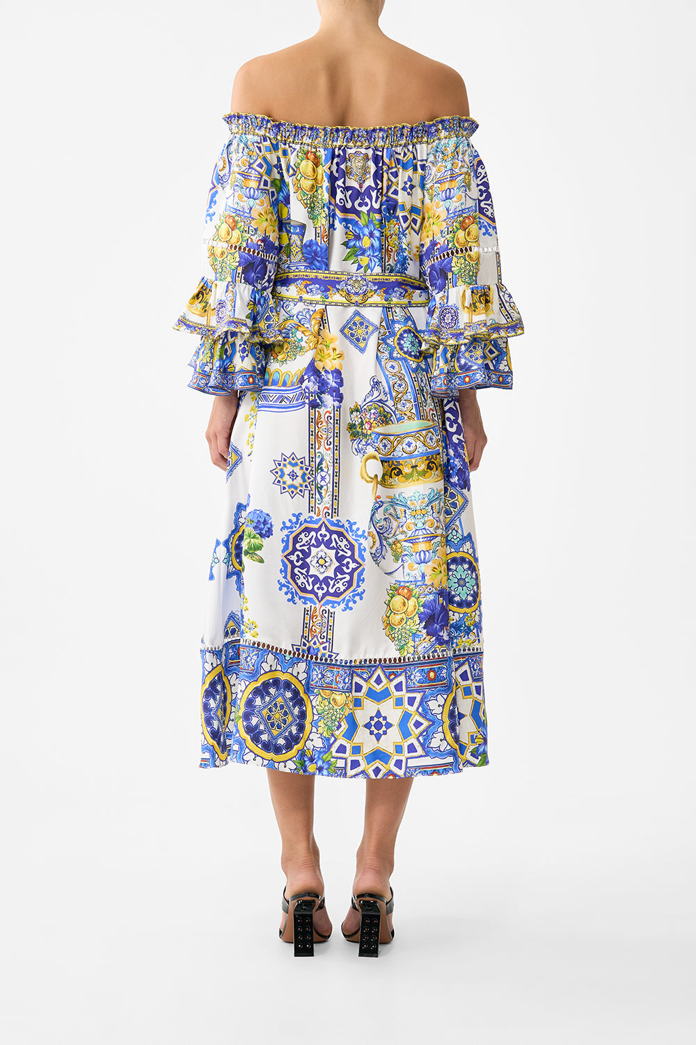 The CAMILLA off shoulder midi dress with frill sleeve in our print España Nirvana. Back model view.