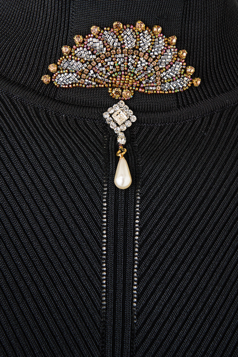 The CAMILLA MOCK NECK KNIT TOP FLAMENCO FOLKLORE in our  print.