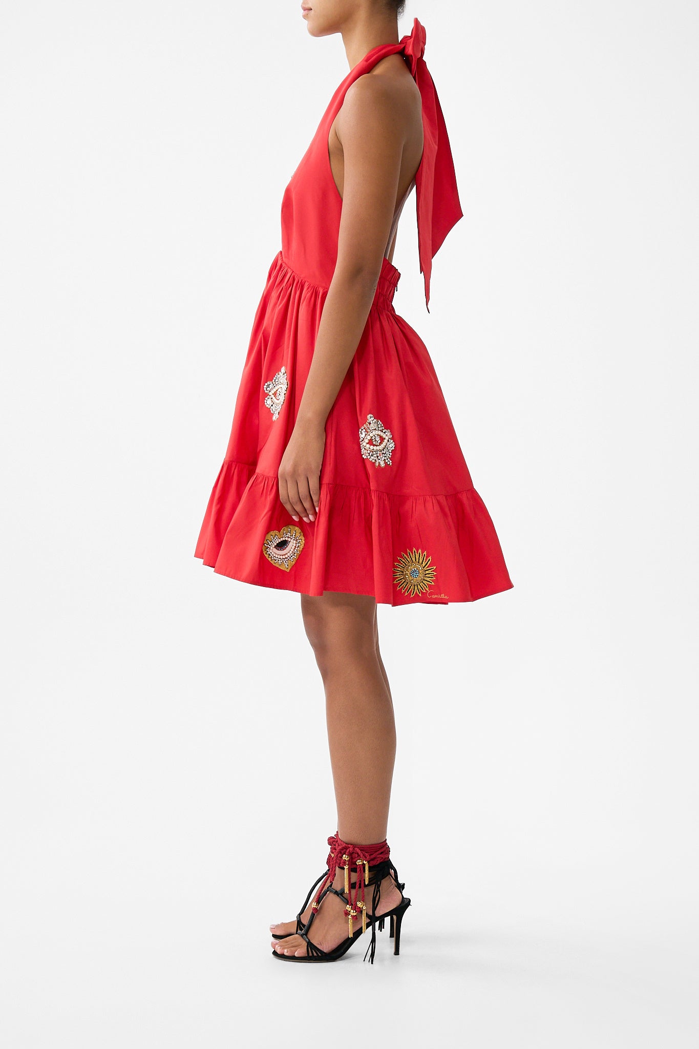 The CAMILLA RUFFLE HEM HALTER SHORT DRESS NAZAR NIRVANA in our  print.