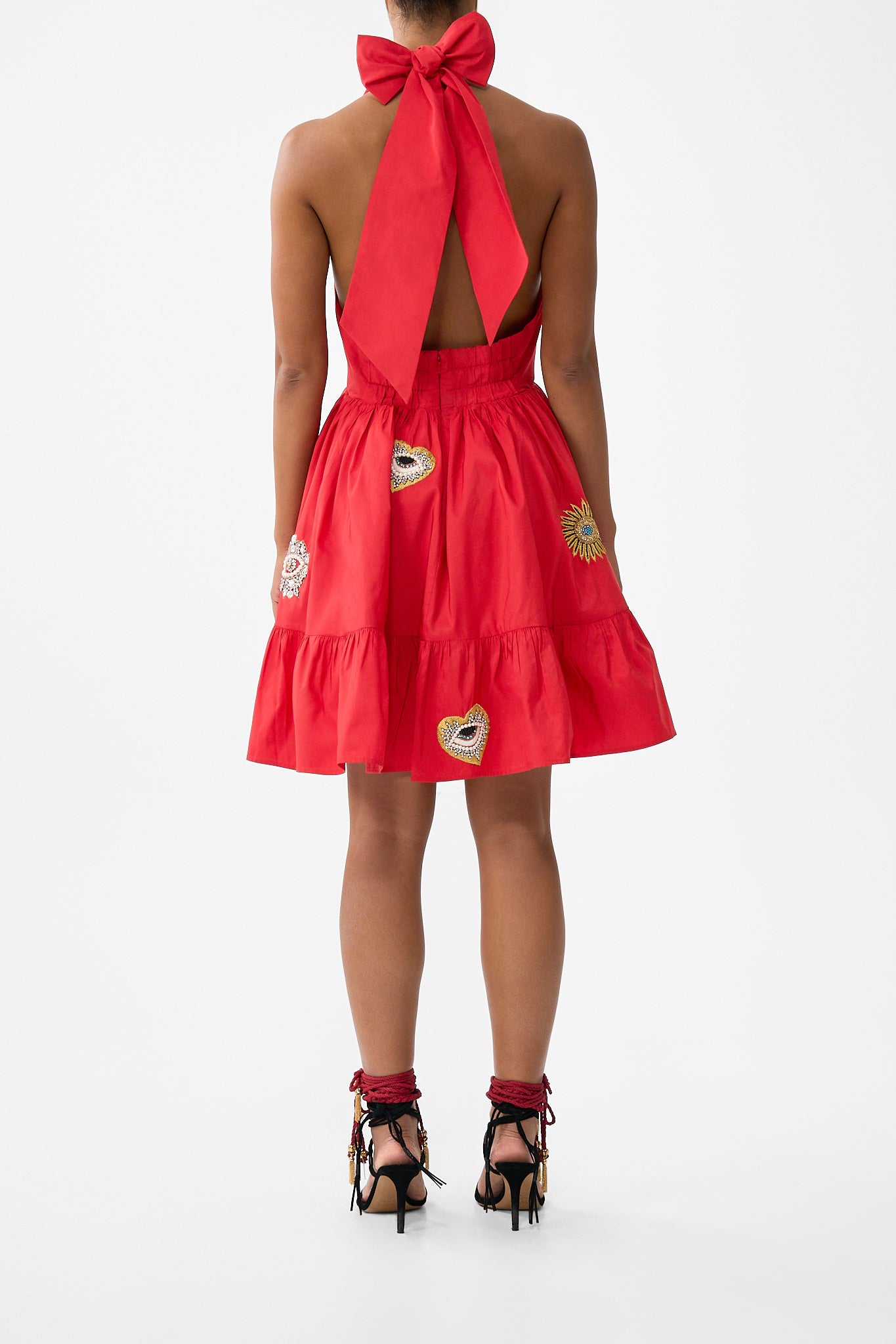The CAMILLA RUFFLE HEM HALTER SHORT DRESS NAZAR NIRVANA in our  print.
