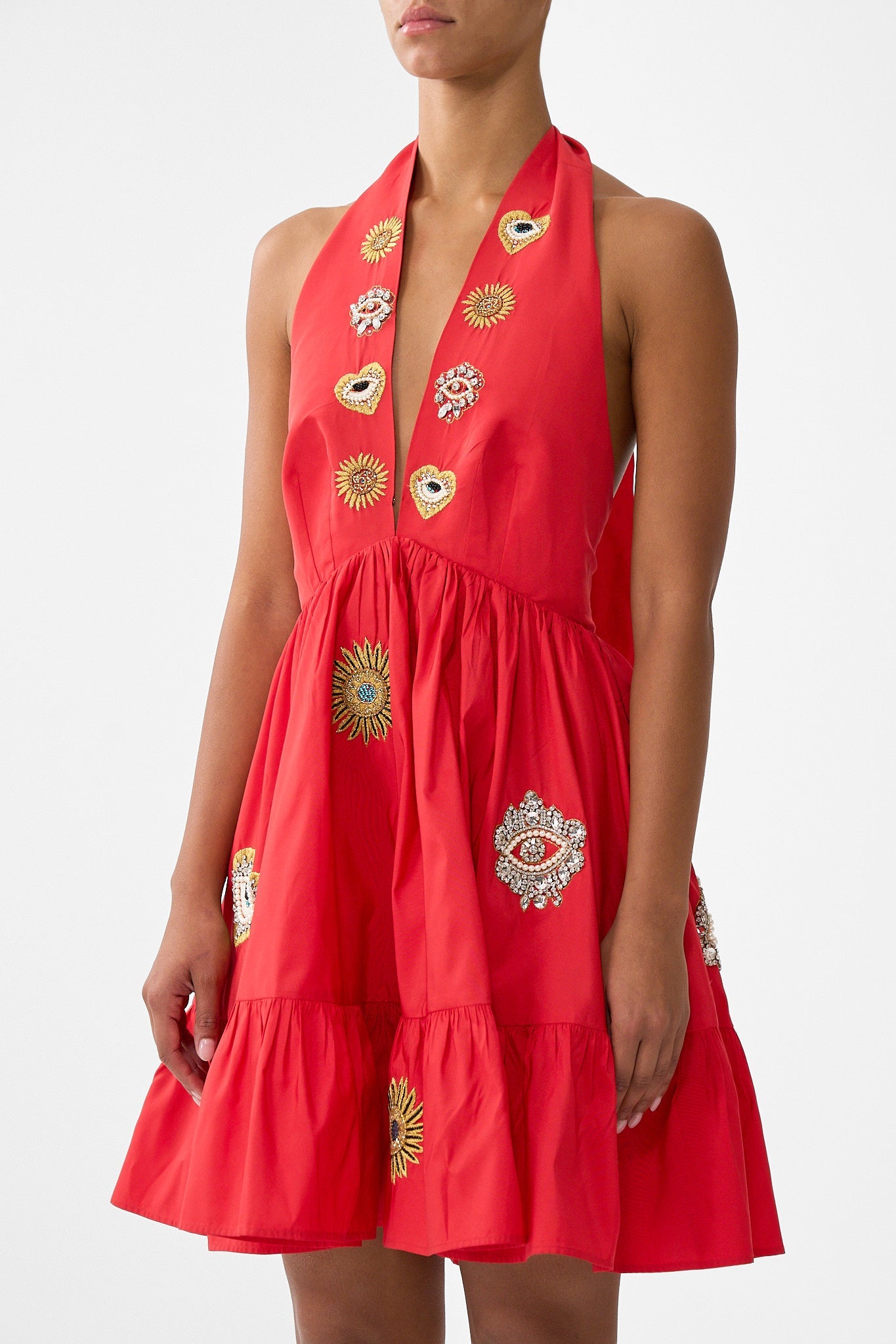 The CAMILLA RUFFLE HEM HALTER SHORT DRESS NAZAR NIRVANA in our  print.