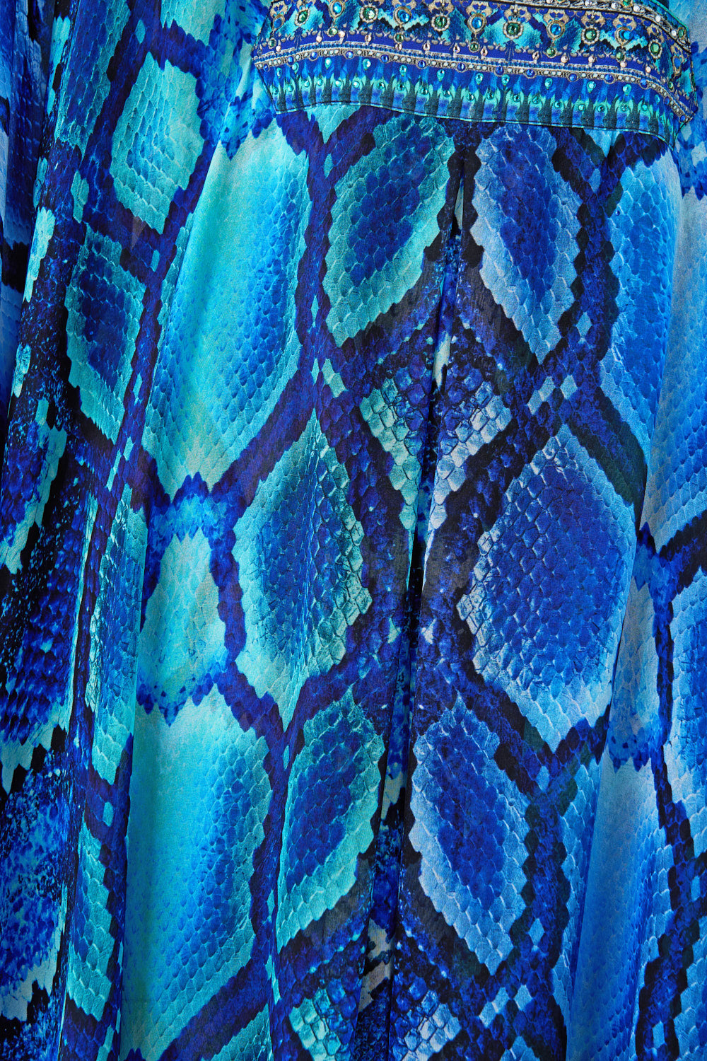 The CAMILLA LONG KAFTAN WITH WAIST DETAIL THE SAPPHIRE SERPENT in our  print.