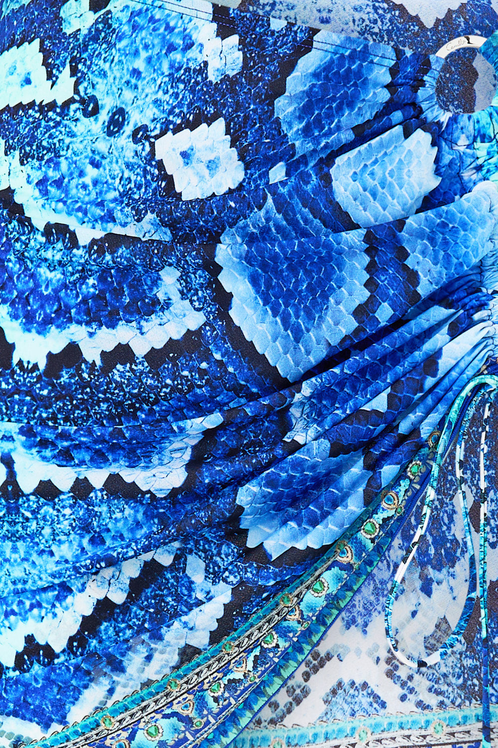 The CAMILLA RUCHED SHORT SARONG W RING FRONT TRIM THE SAPPHIRE SERPENT in our  print.