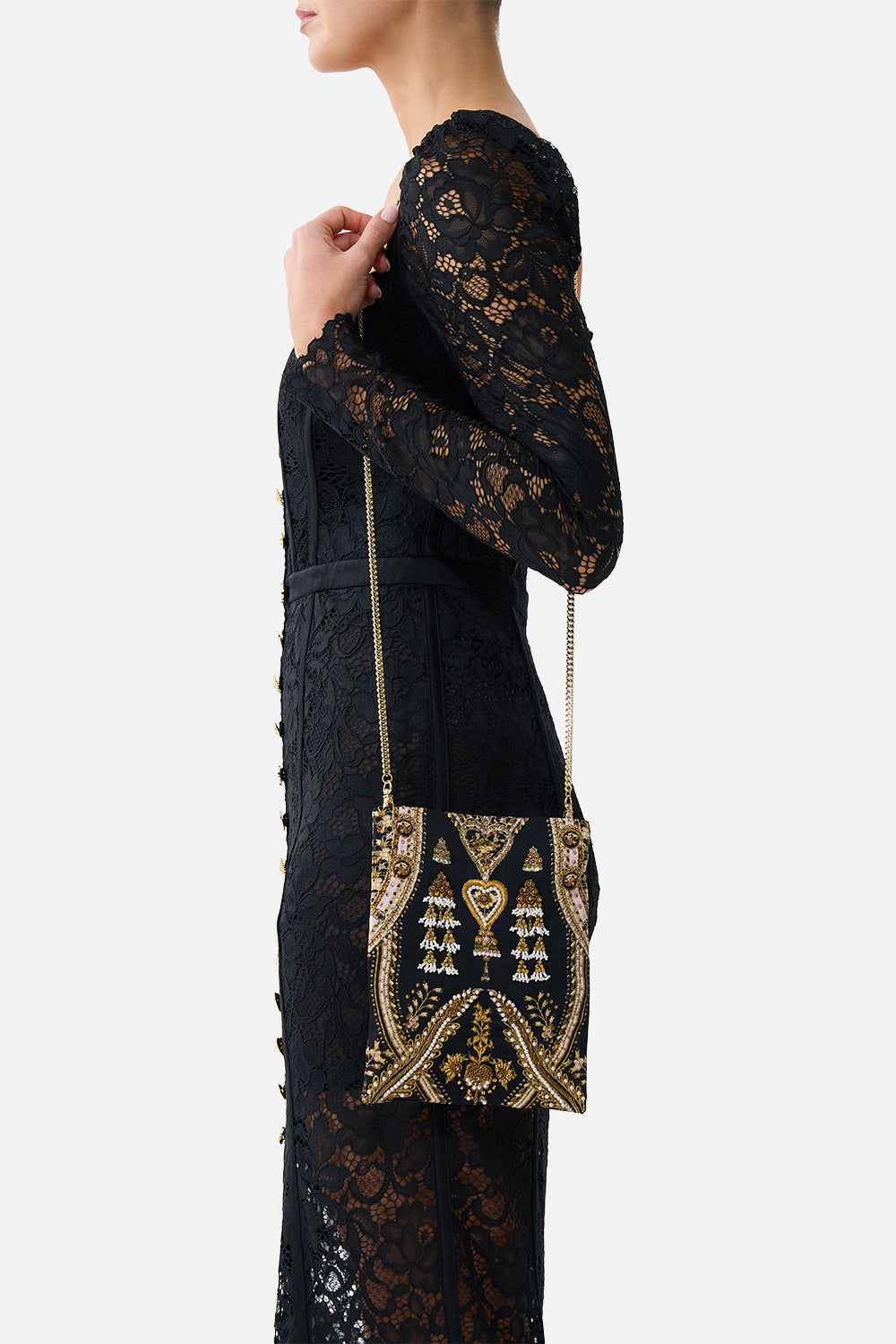 The CAMILLA embellished mini tote with chain strap in our print Taurus Rising. Side model view.
