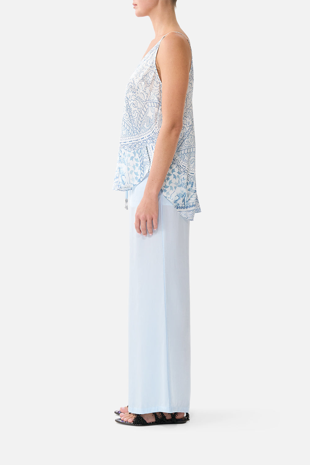 The CAMILLA lounge pant in our print The Hum of the Alhambra. Side model view.