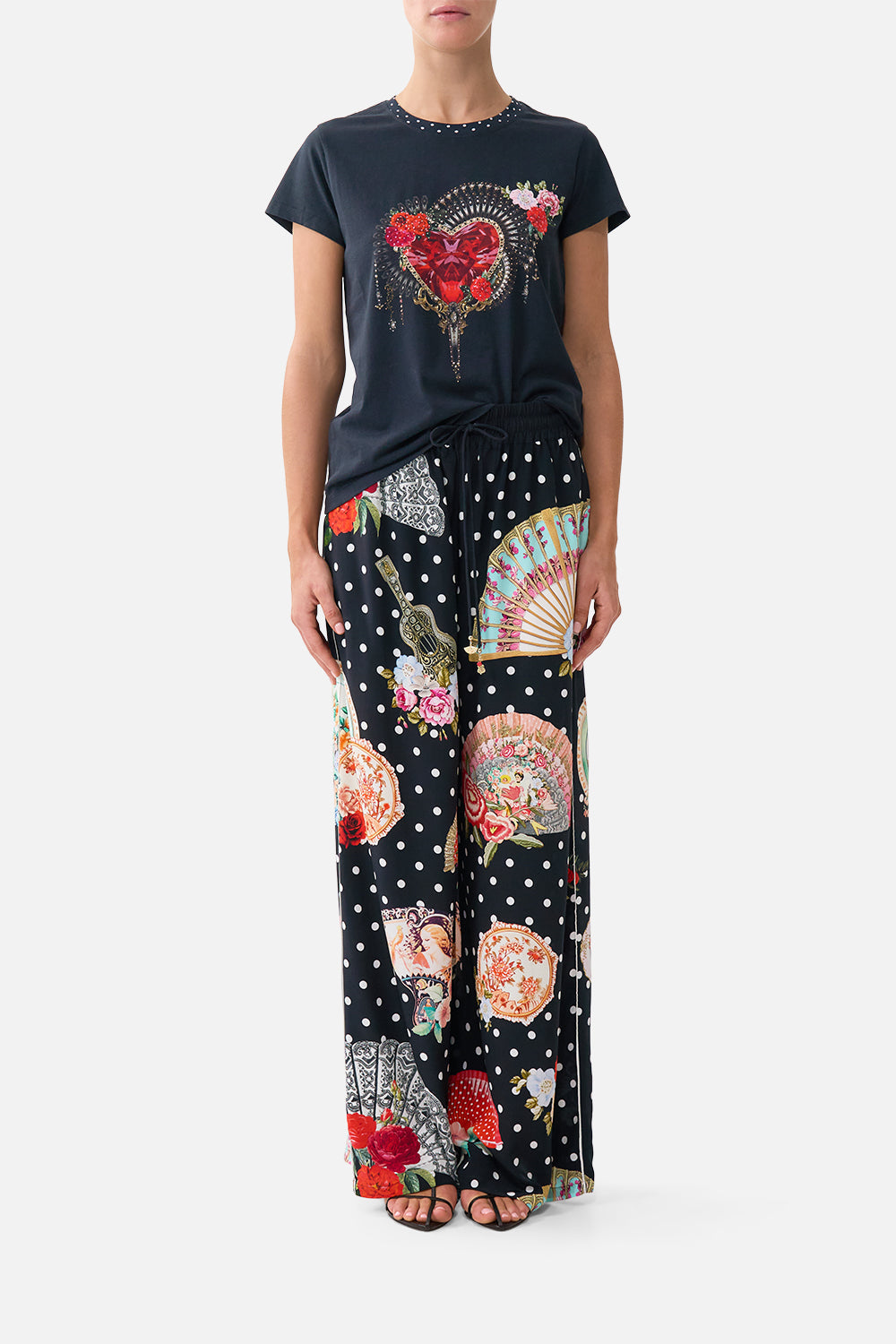 The CAMILLA SLIM FIT ROUND NECK T-SHIRT - BLACK DAUGHTERS OF DUENDE in our DAUGHTERS OF DUENDE print.