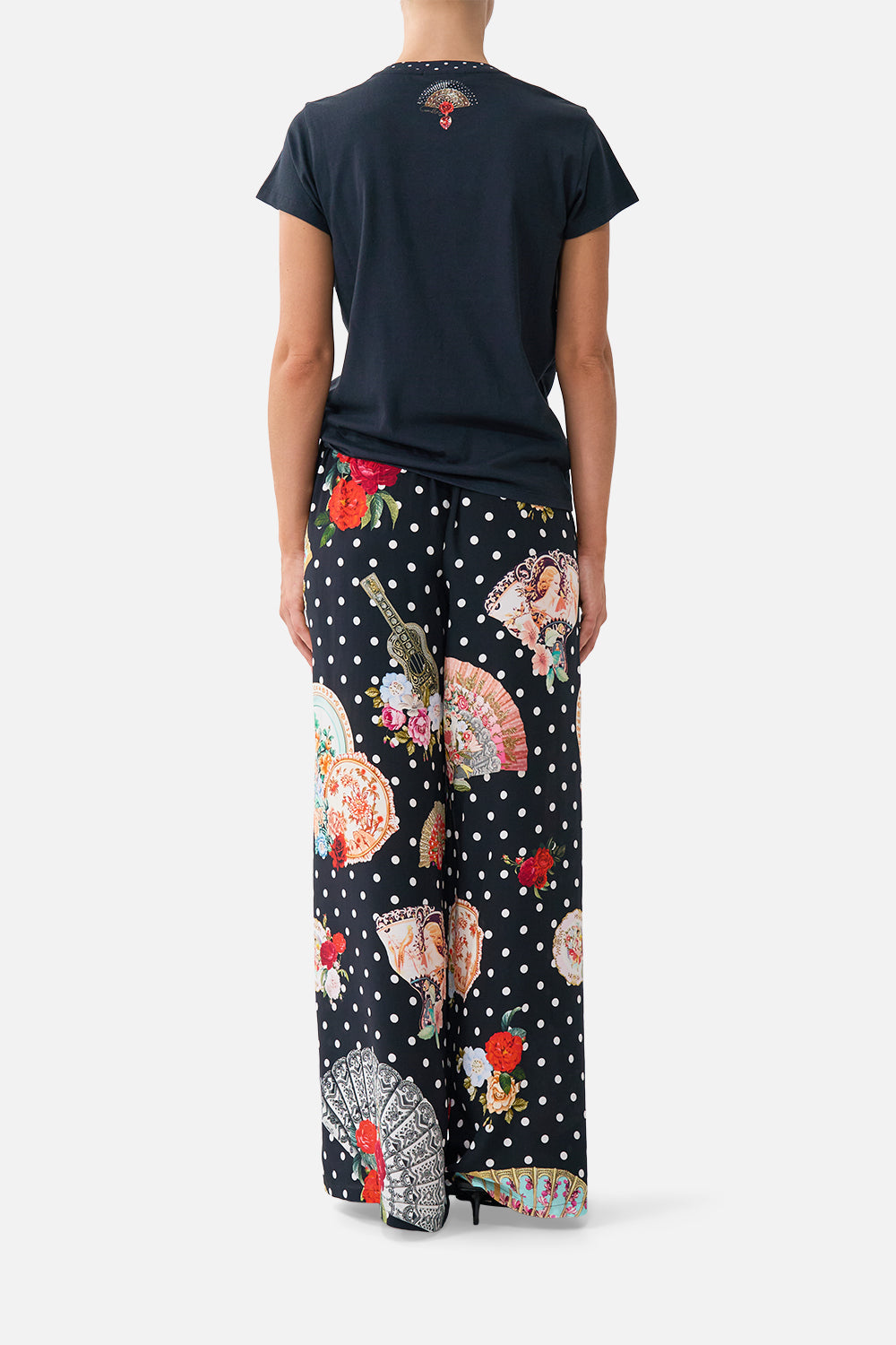 The CAMILLA SLIM FIT ROUND NECK T-SHIRT - BLACK DAUGHTERS OF DUENDE in our  print.