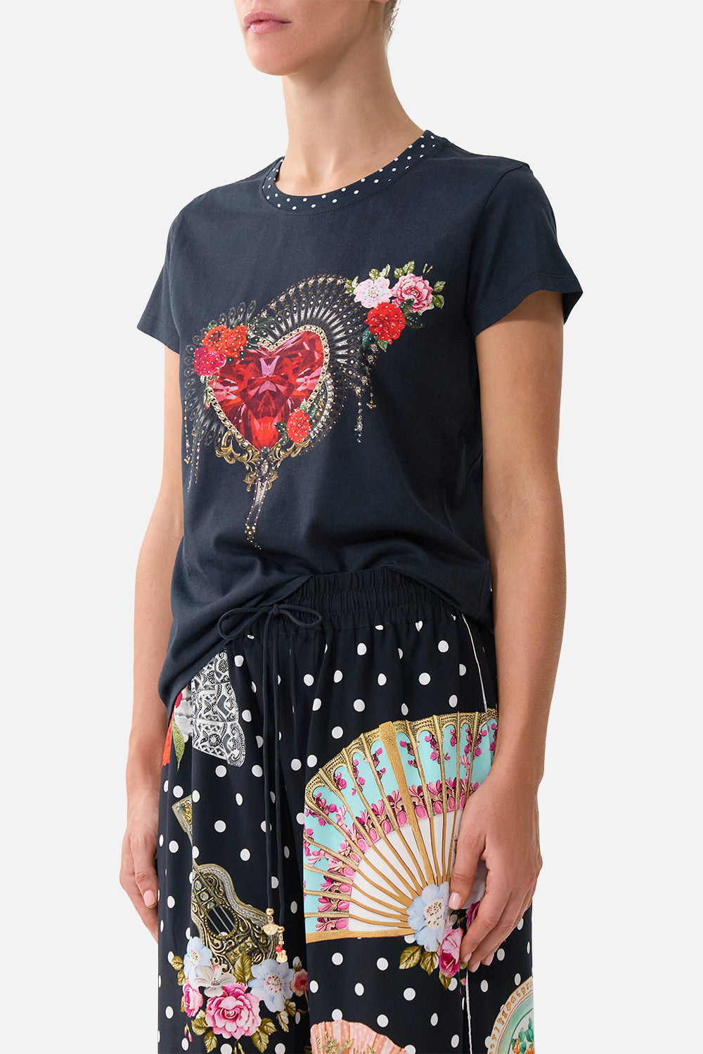 The CAMILLA SLIM FIT ROUND NECK T-SHIRT - BLACK DAUGHTERS OF DUENDE in our  print.