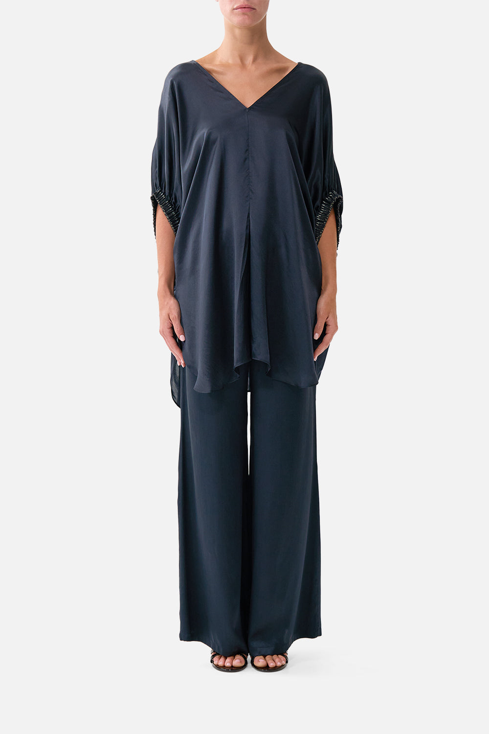 The CAMILLA GATHERED CUFF V NECK TOP DAUGHTERS OF DUENDE in our DAUGHTERS OF DUENDE print.